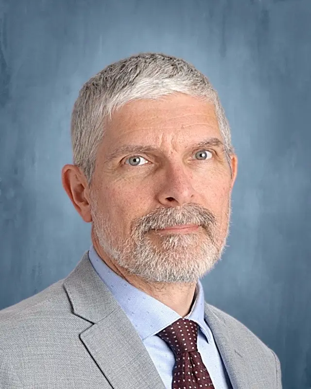 Mr. Michael Louvaris